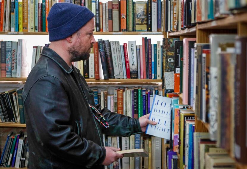 
Oak Cliff resident Tim Kerlin peruses the shelves. Lucky Dog Books’ space has been leased...