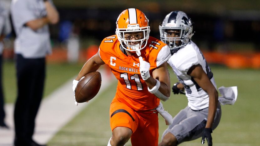 Rockwall's Jaxon Smith-Njigba (11) runs up the field after the catch in a game against...