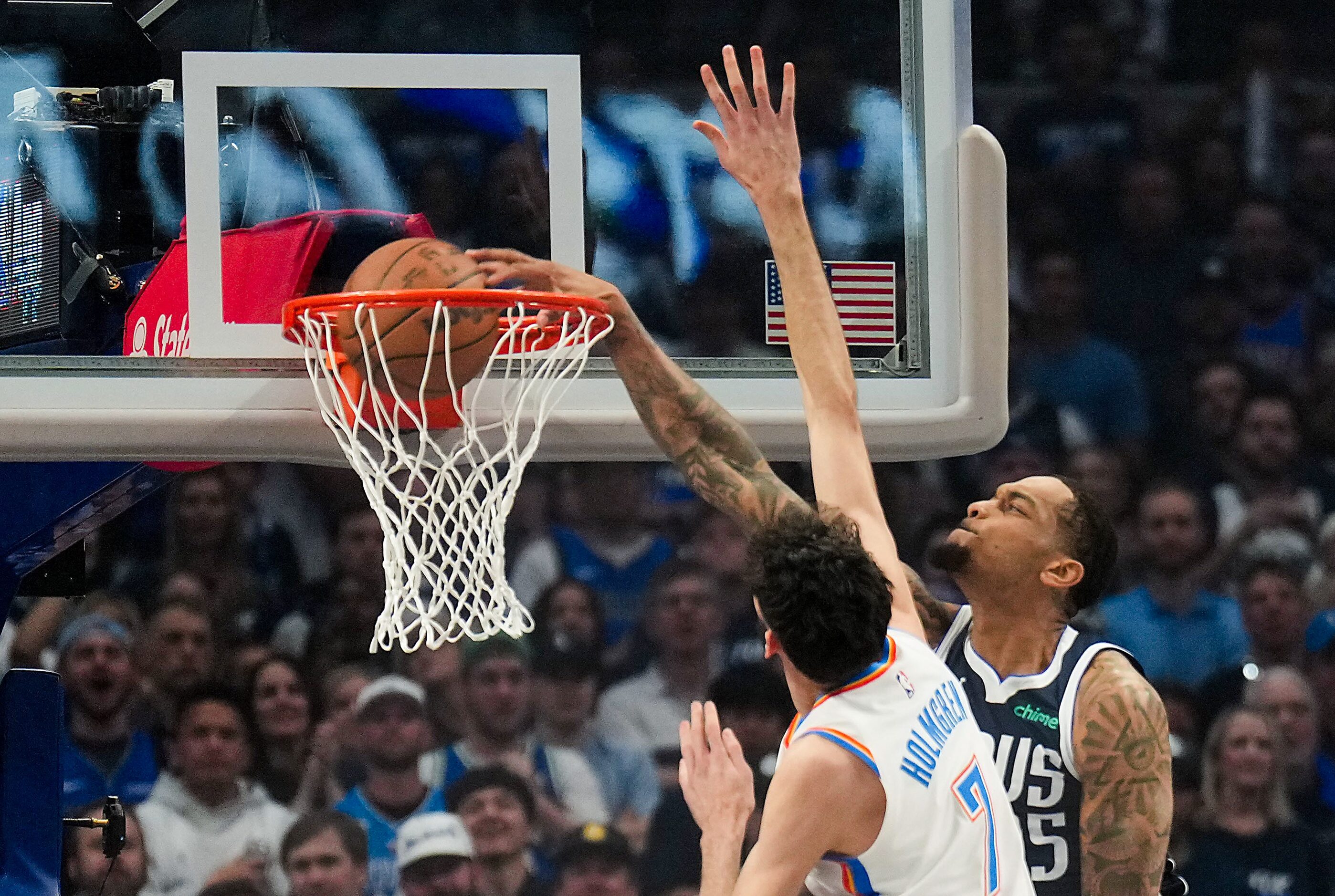 Dallas Mavericks forward P.J. Washington (25) dunks the ball against Oklahoma City Thunder...