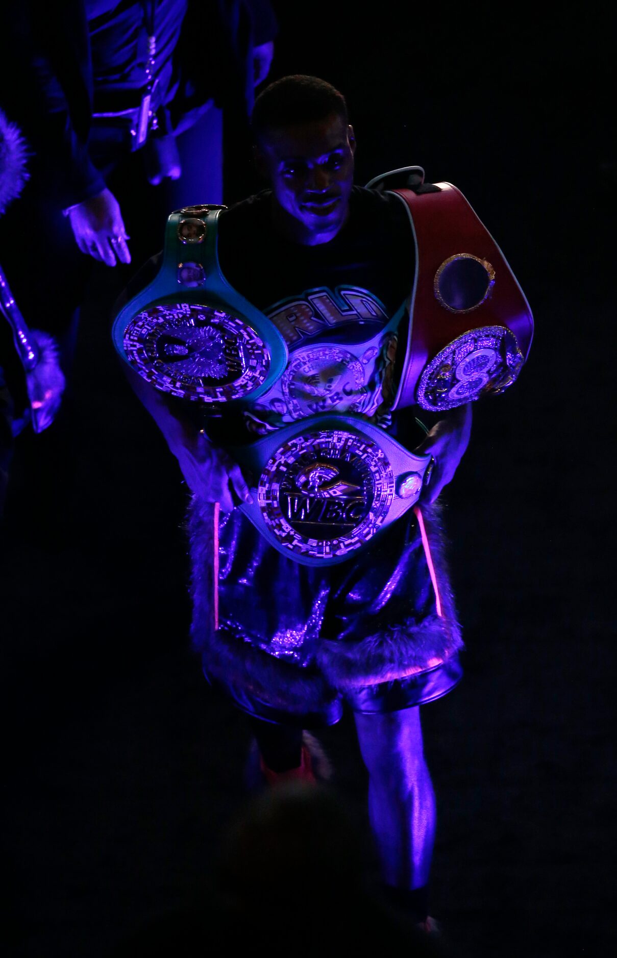 Errol Spence, Jr. exits the arena with his championship belts after defeating Danny García...