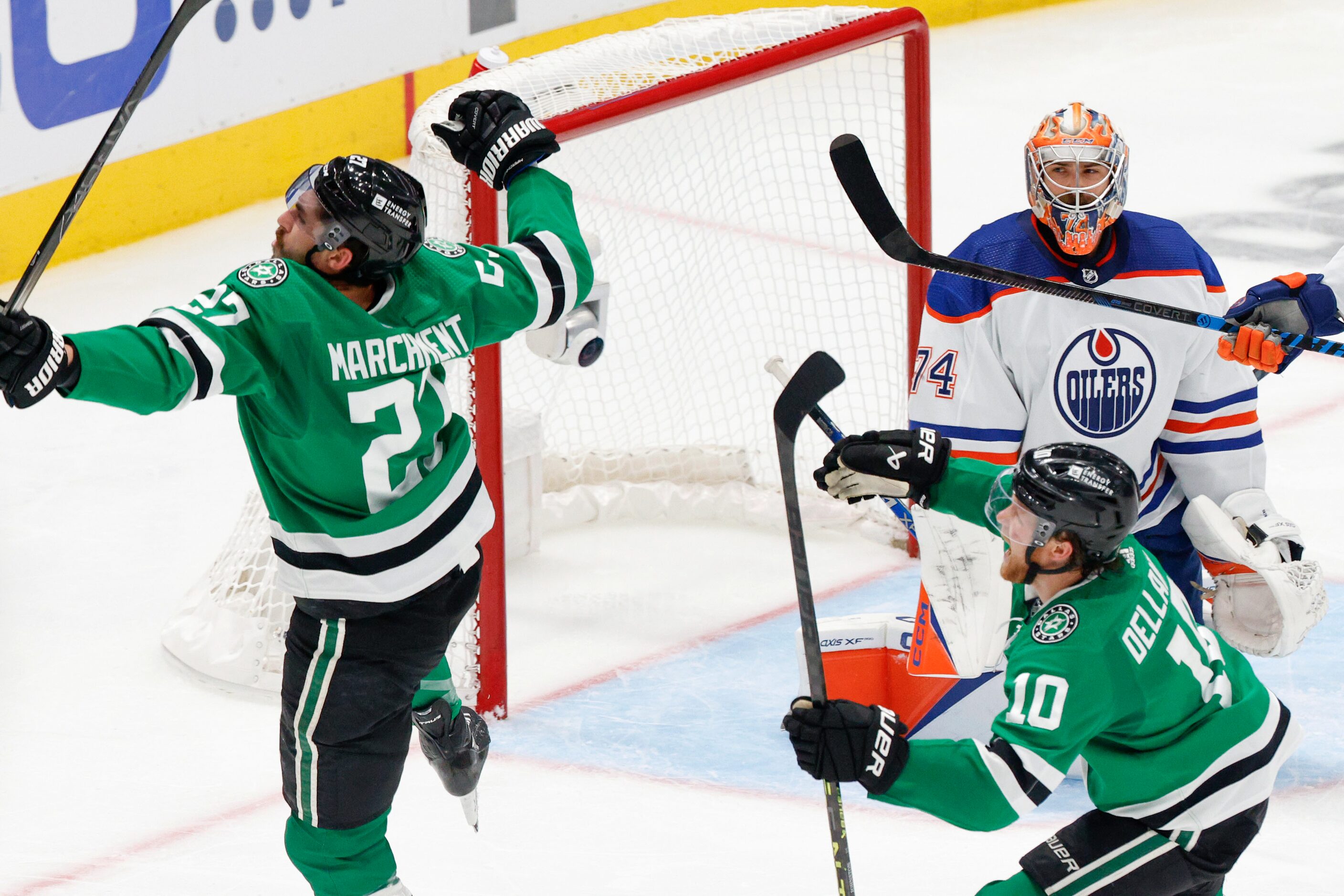 Dallas Stars left wing Mason Marchment (27) celebrates with center Ty Dellandrea (10) after...