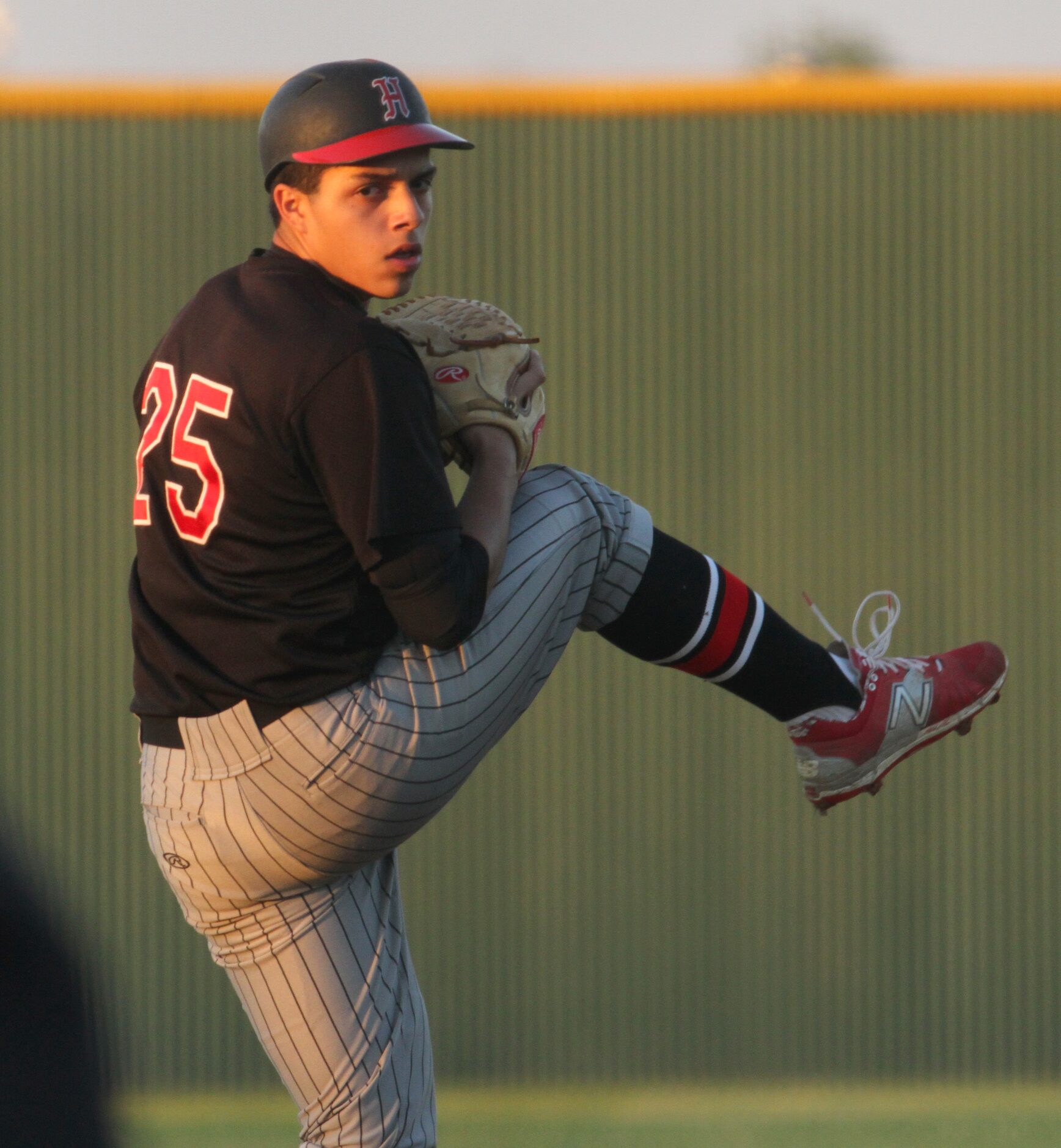 Dallas Hillcrest pitcher Steven Santoyo (25) delivers a pitch to a Carrollton Creekview...