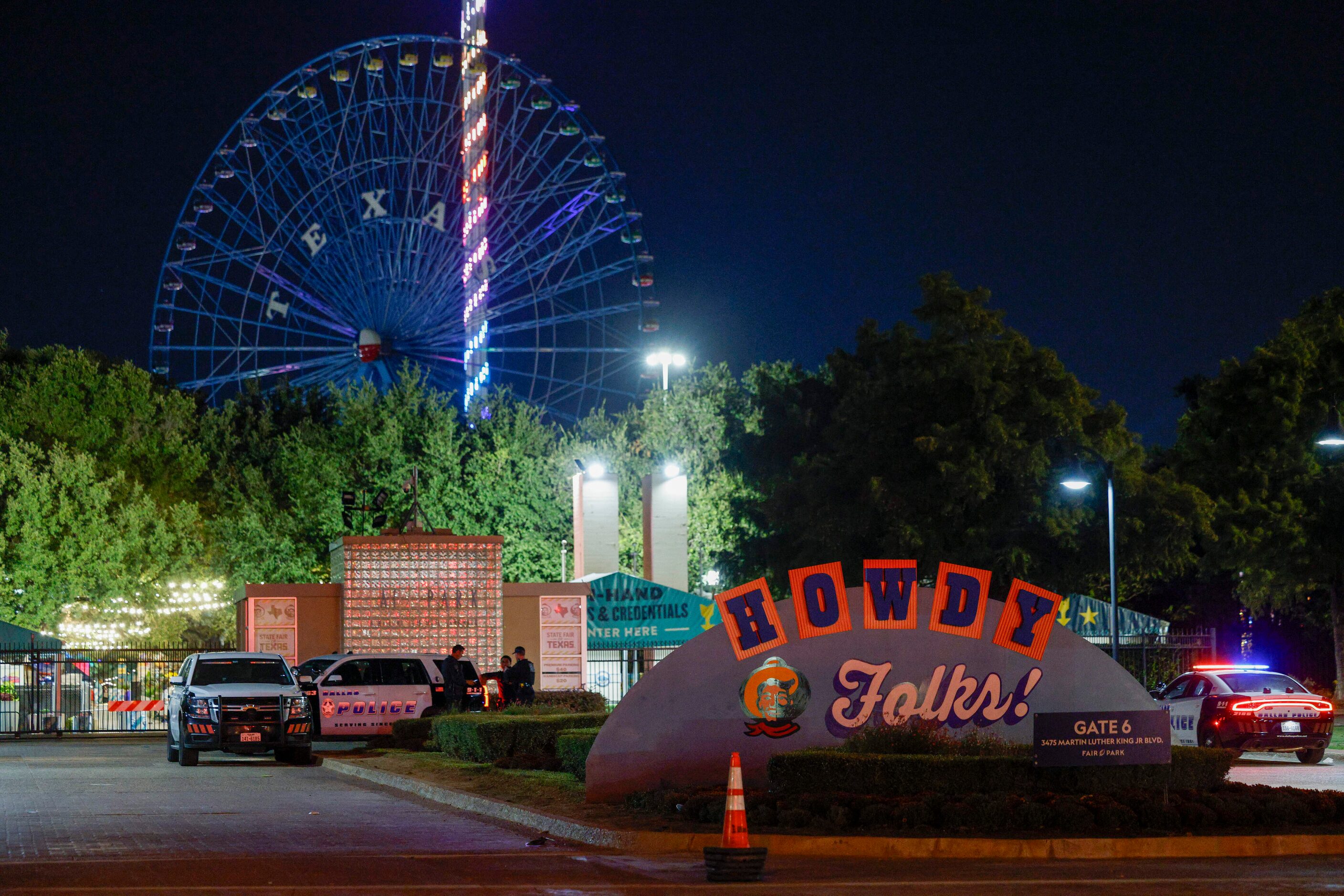 Dallas police block an entrance to the State Fair of Texas after a shooting, Saturday, Oct....