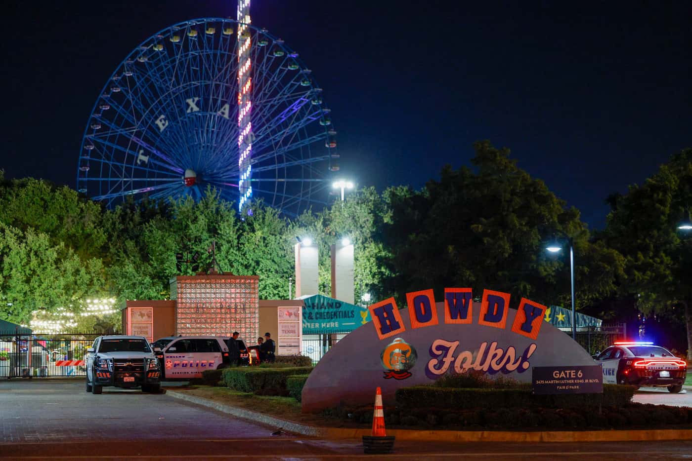Dallas police block an entrance to the State Fair of Texas after a shooting, Saturday, Oct....