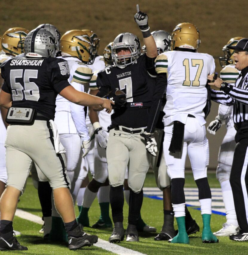 Arlington Martin High QB Josh Watson (7) points to the sky after scoring the teams first...