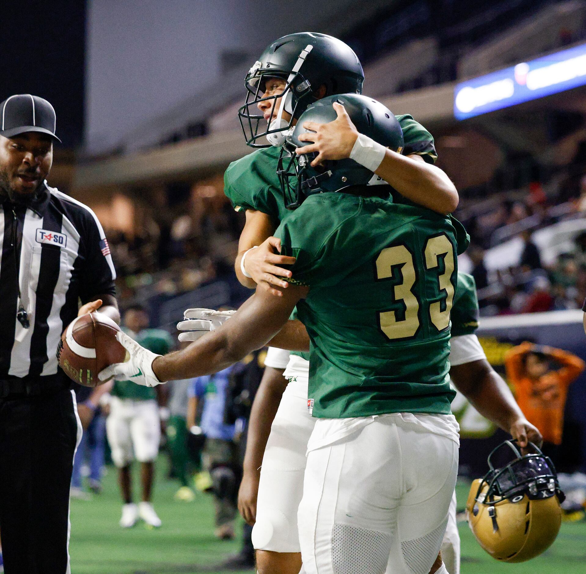 DeSoto’s Marvin Duffey (33) celebrates a touchdown with teammates during the second half of...