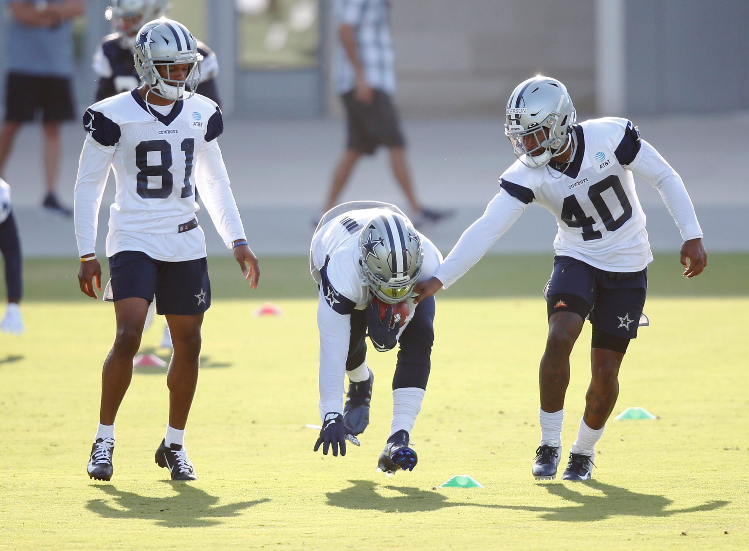 Dallas Cowboys running back Ezekiel Elliott (21) runs through a drill as Dallas Cowboys wide...