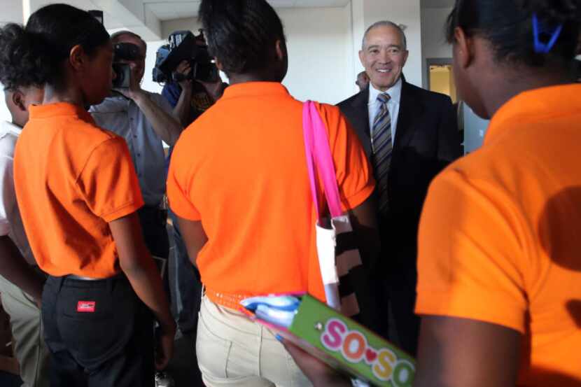 DISD Superintendent Mike Miles greets students as they arrived for the first day of school...