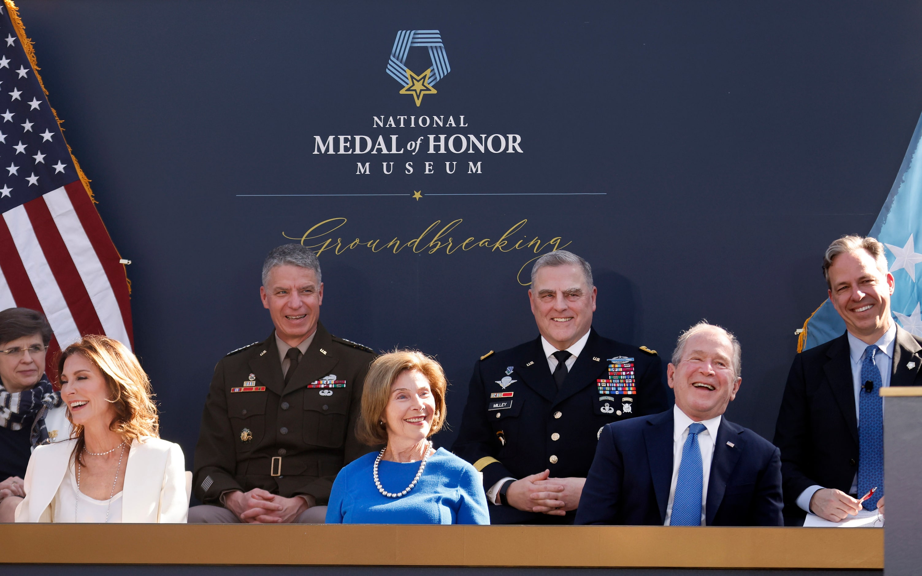 Front row from right: Former President George W. Bush, wife Laura and Dallas Cowboys...