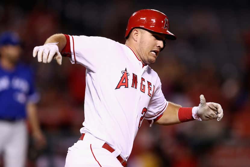 ANAHEIM, CA - SEPTEMBER 15:  Mike Trout #27 of the Los Angeles Angels of Anaheim reacts to...