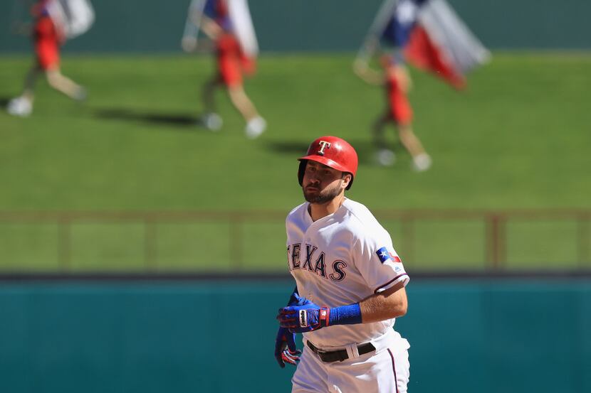 ARLINGTON, TX - APRIL 23:  Joey Gallo #13 of the Texas Rangers runs the bases after a home...