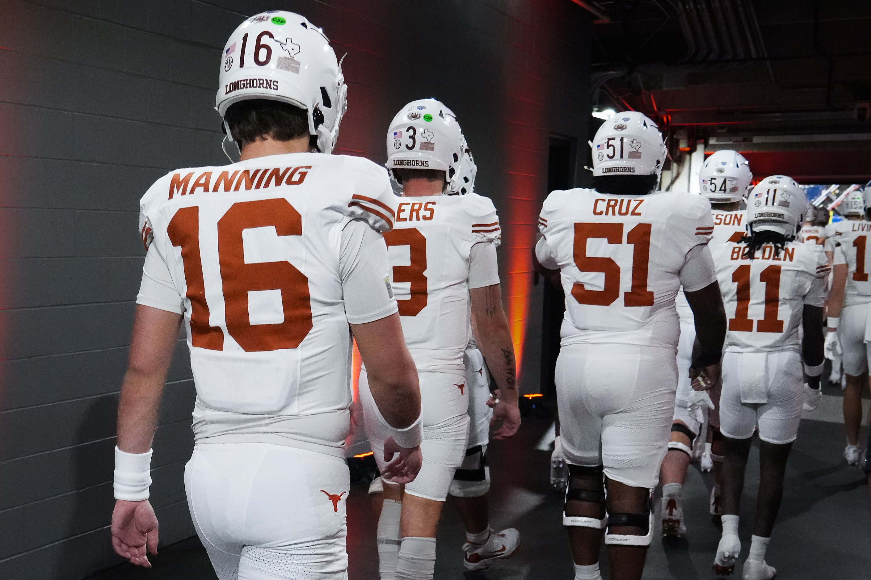 Texas quarterback Arch Manning (16) and quarterback Quinn Ewers (3) head down the tunnel to...