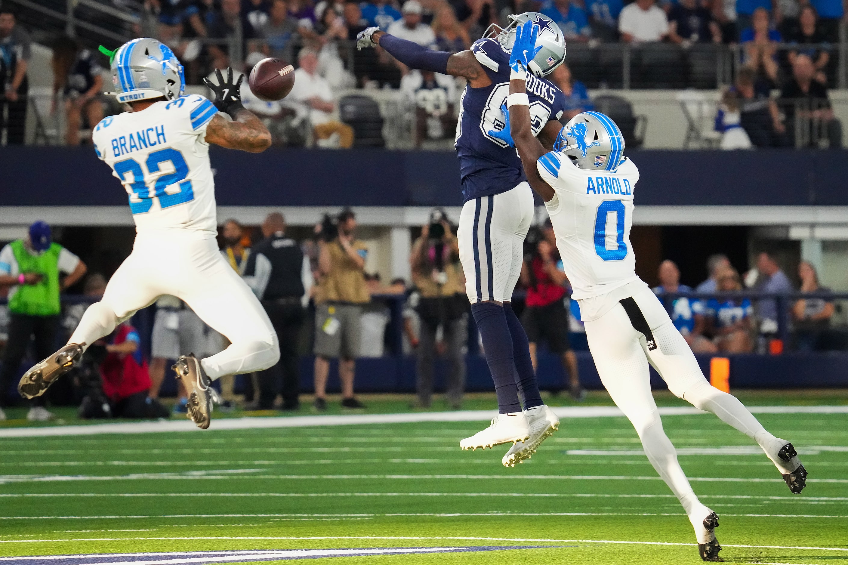 Detroit Lions safety Brian Branch (32) intercepts a pass intended for Dallas Cowboys wide...