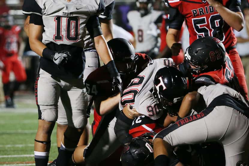 Euless Trinity linebacker Jeremiah Kneubuhl (10) reacts after a Euless Trinity tackle in the...