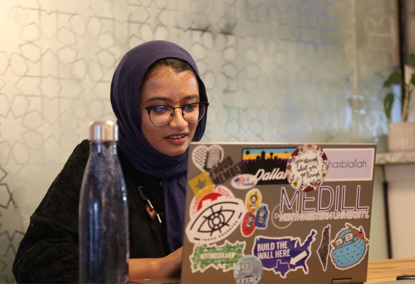 Amal Ahmed works on her laptop.