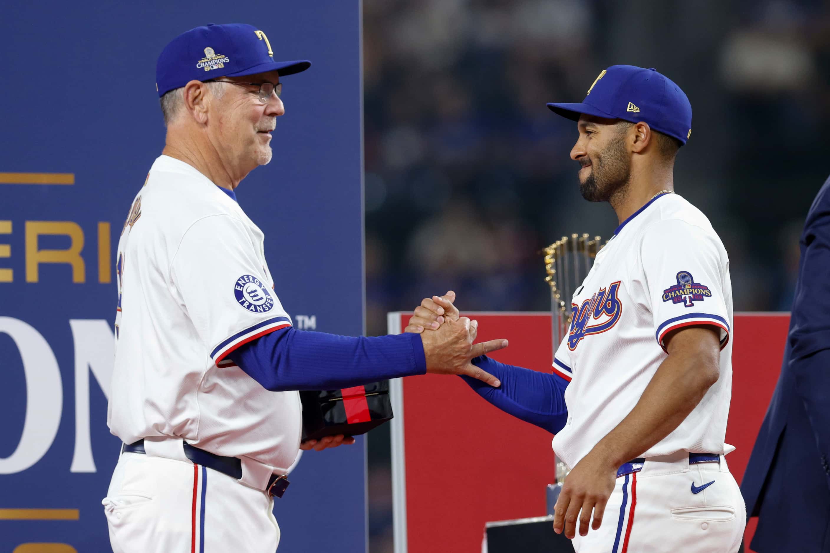 Texas Rangers manager Bruce Bochy greets second baseman Marcus Semien as he presents him...