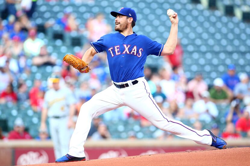 ARLINGTON, TX - JUNE 05: Matt Moore #55 of the Texas Rangers throws in the first inning...