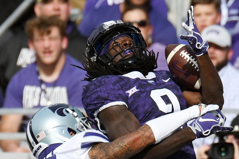 Kansas State's Kevion McGee, left, breaks up a pass intended for TCU's Tevailance Hunt...
