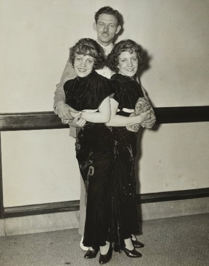 Violet and Daisy Hilton pose with Violet's fiance, Maurice Lambert. The couple applied for...