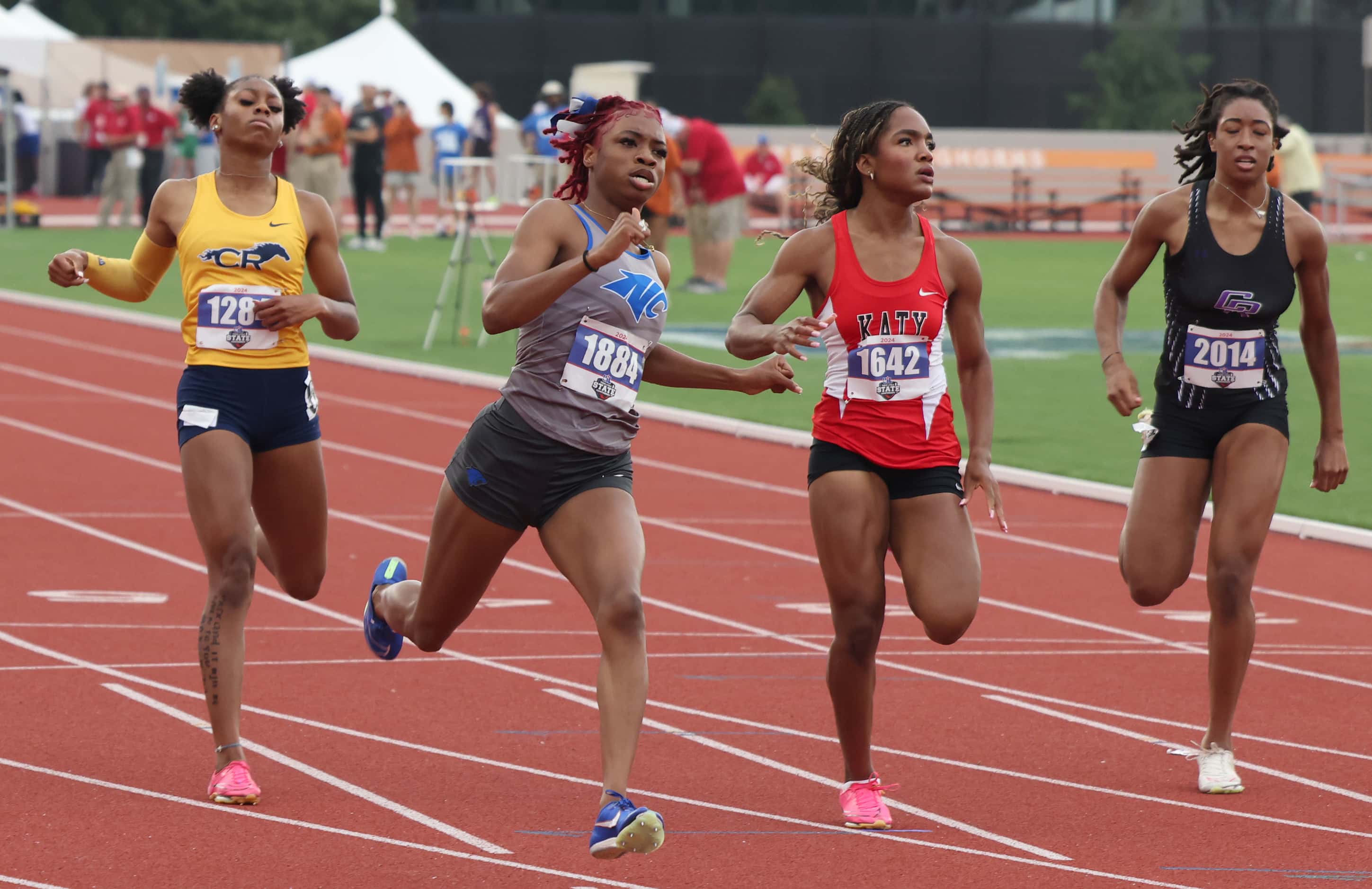 North Crowley sprinter Indya Mayberry, second from left, won the Class 6A Girls 100 meter...