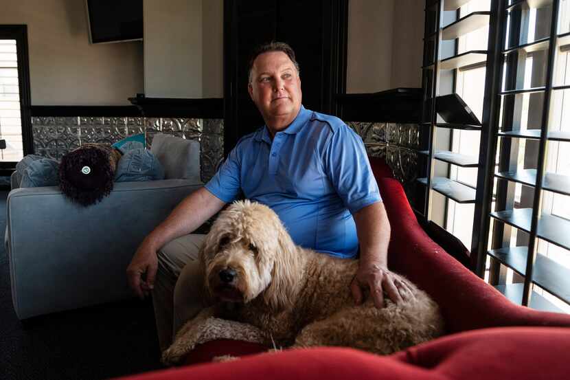 Jim Doyle with his dog Dempsey at his home in Lewisville, on Aug. 11, 2021. Doyle recovered...