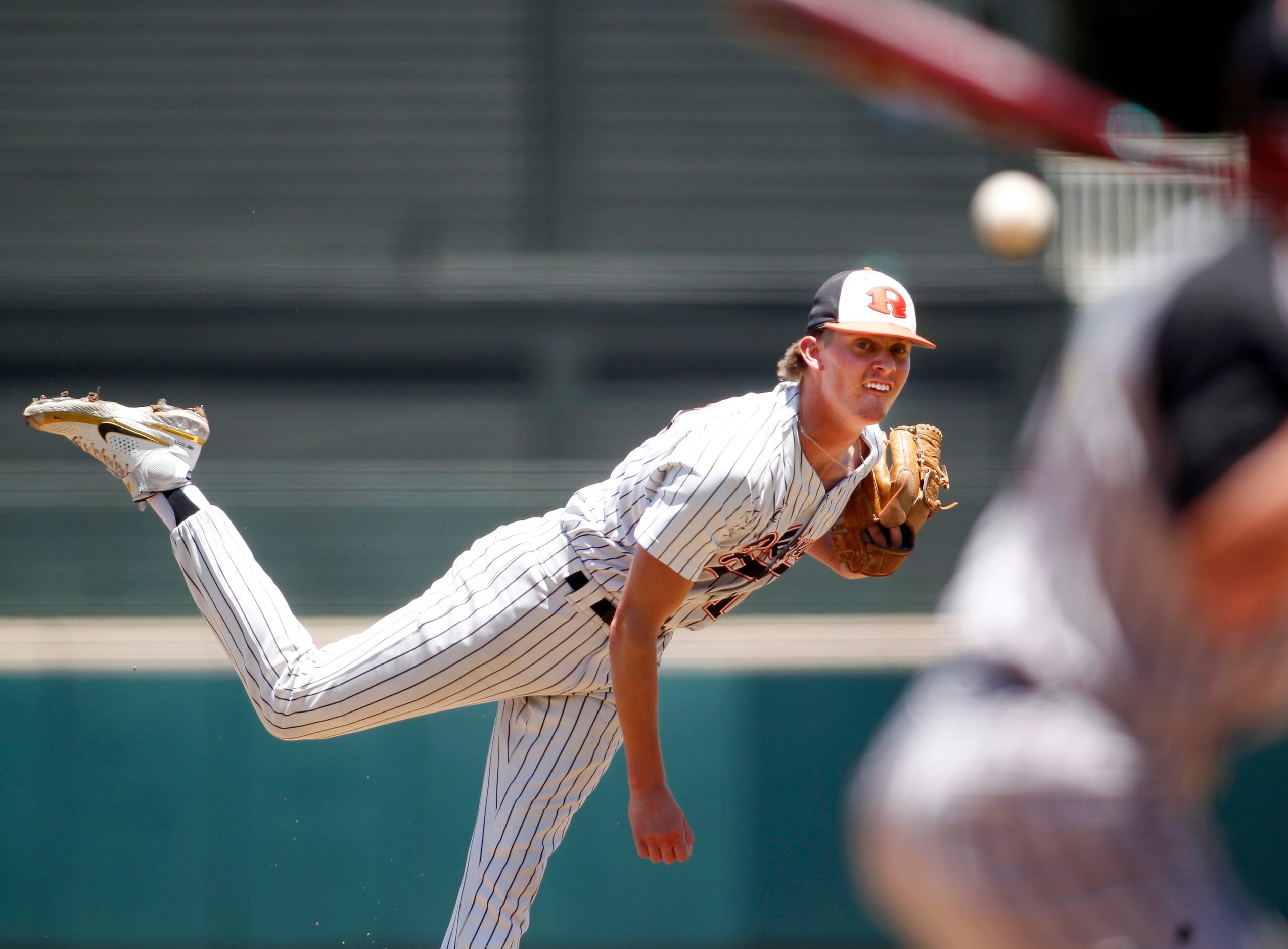 Rockwall pitcher Charlie Ciese (19) delivers a pitch to a Rockwall Heath batter during the...