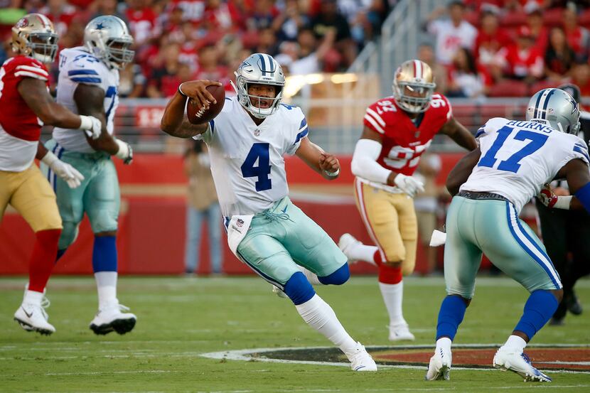 Dallas Cowboys quarterback Dak Prescott (4) runs for a first down against San Francisco...