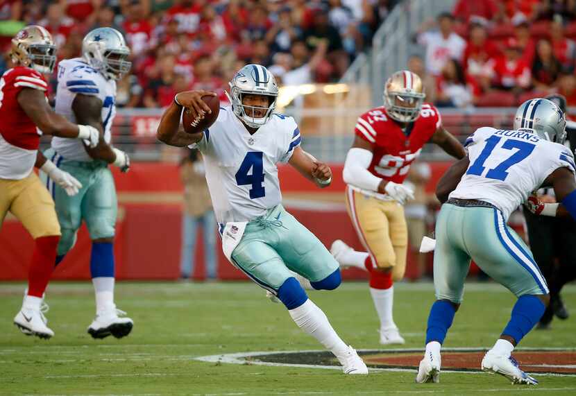 Dallas Cowboys quarterback Dak Prescott (4) runs for a first down against San Francisco...