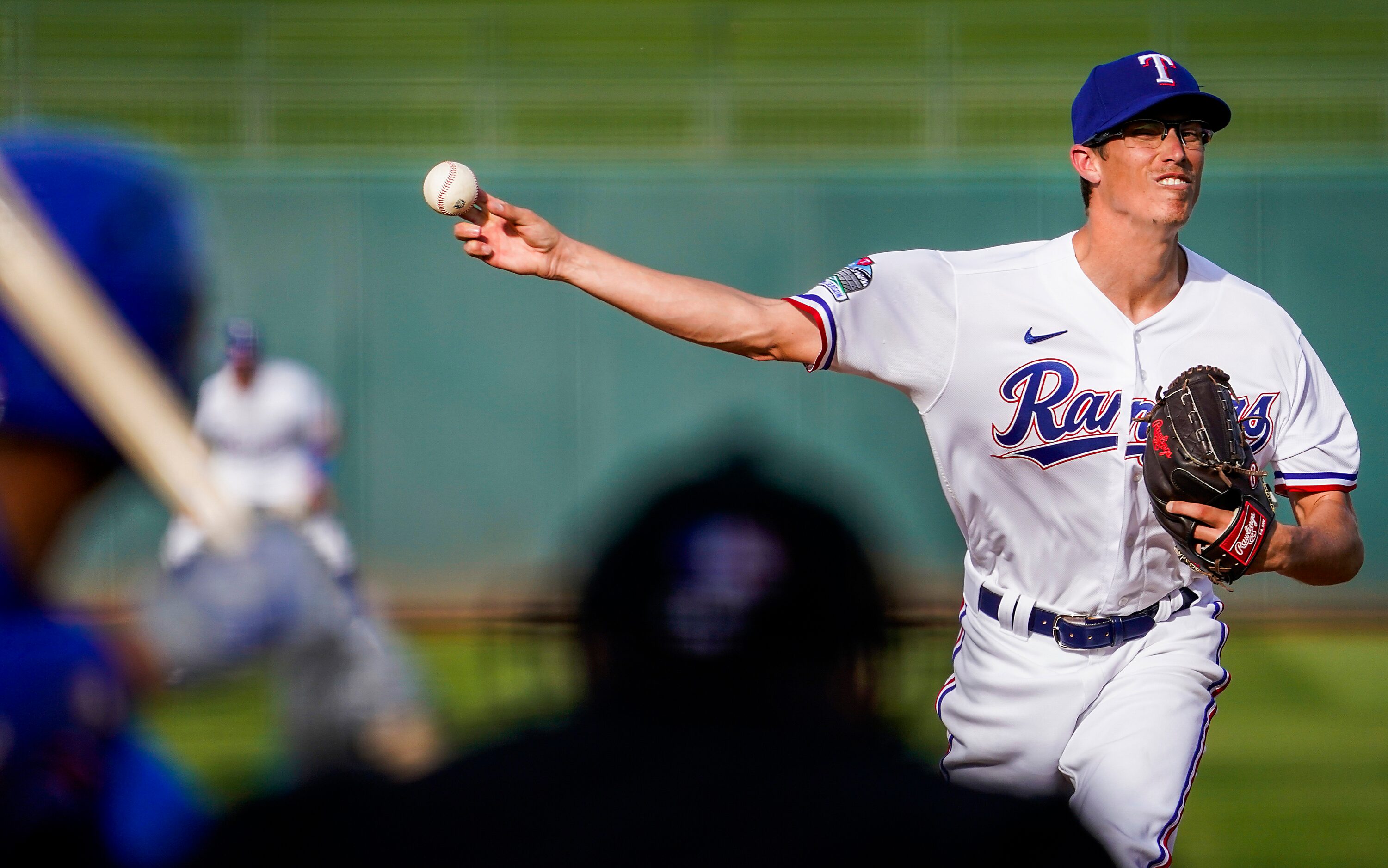 Texas Rangers pitcher Jimmy Herget pitches during the ninth inning of a spring training game...