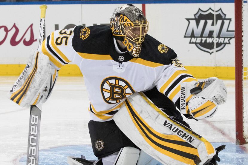 Boston Bruins goaltender Anton Khudobin makes a glove save during the second period of an...