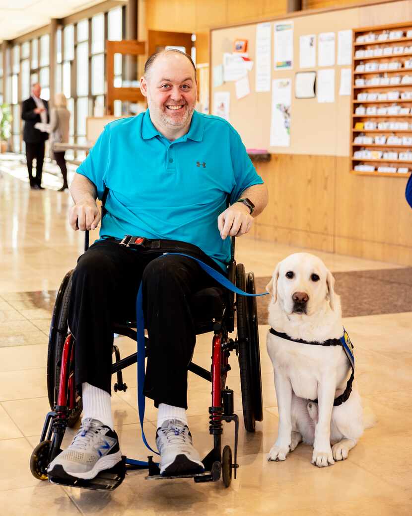 man in wheelchair with service dog