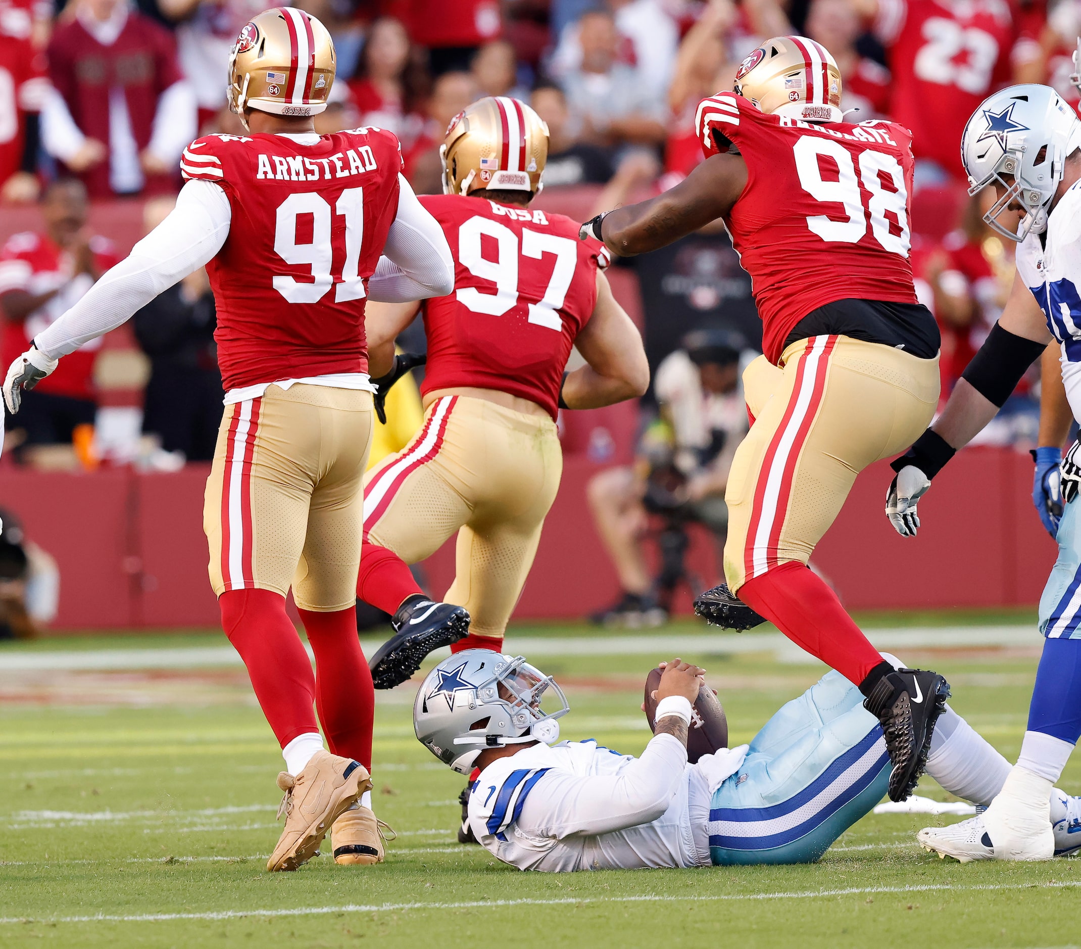 Dallas Cowboys quarterback Dak Prescott (4) is slow to get up after being sacked by San...