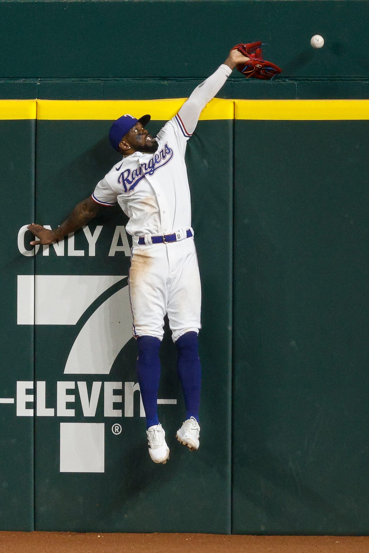 Los Angeles Angels right fielder Hunter Renfroe (12) hits a two run home run over a leaping...