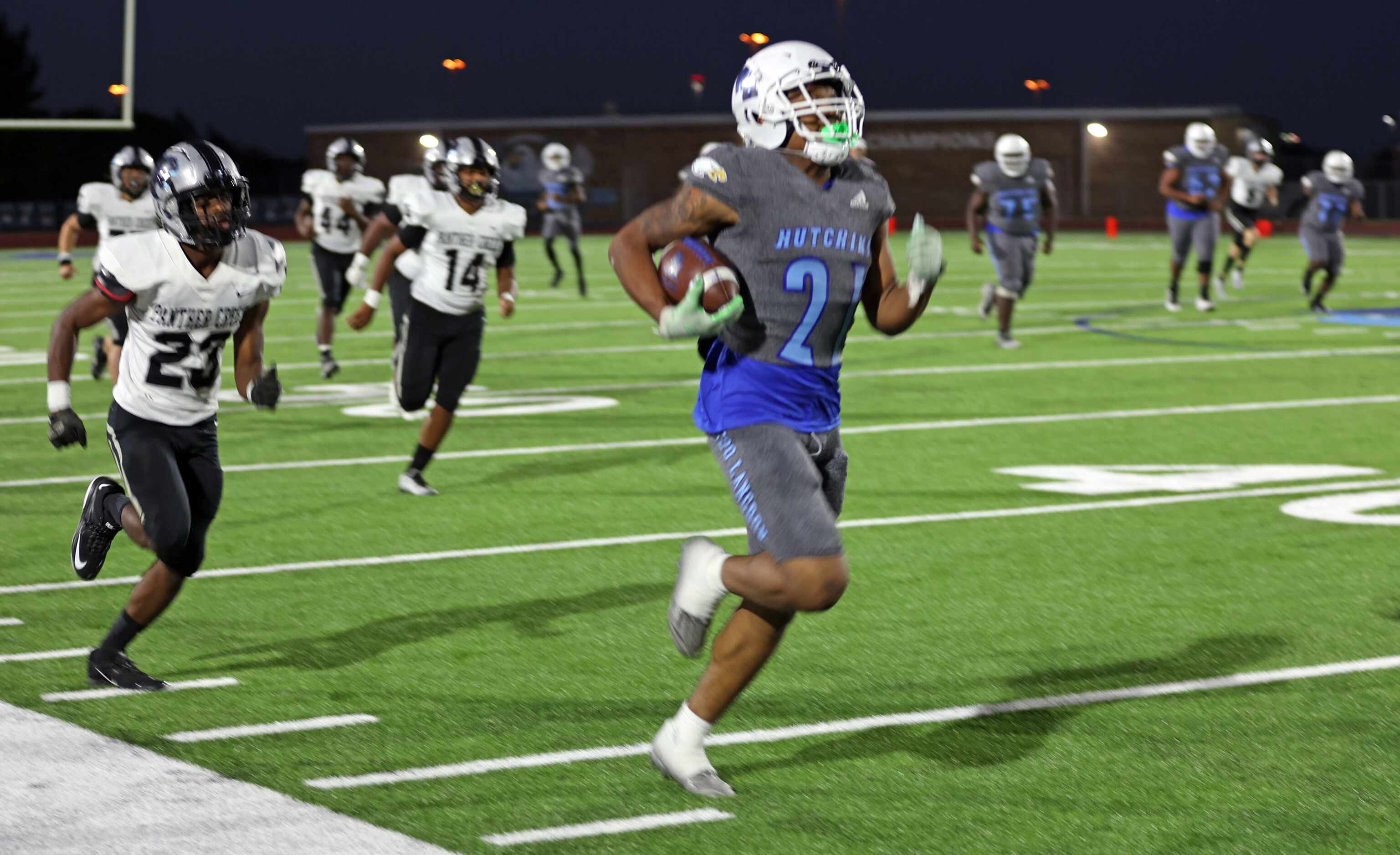 Wilmer-Hutchins’ Zadrian Turner (21) picks up big yards on a long run, as Frisco Panther...