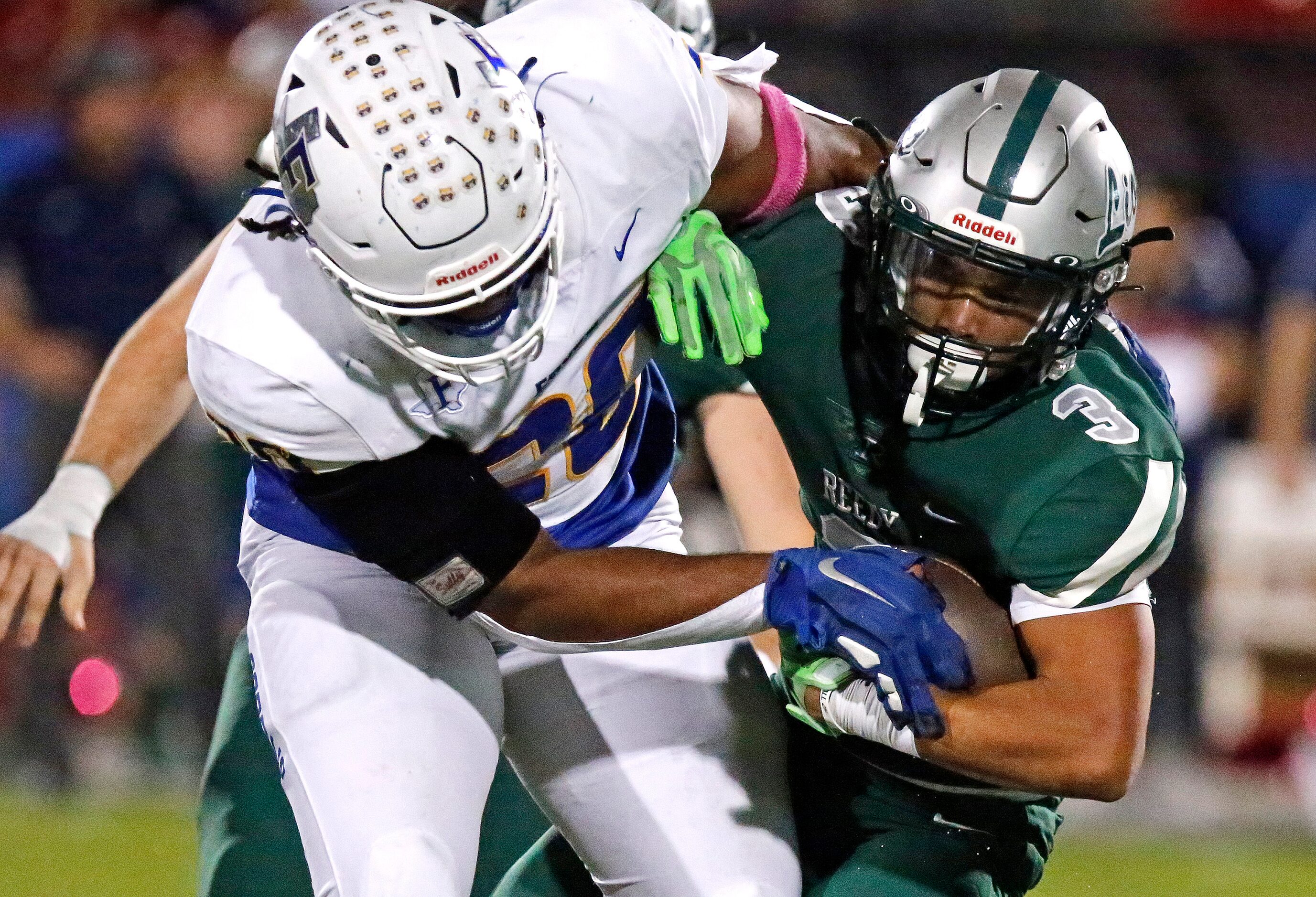 Reedy High School running back Dennis Moody (3) is tackled by Frisco High School defensive...