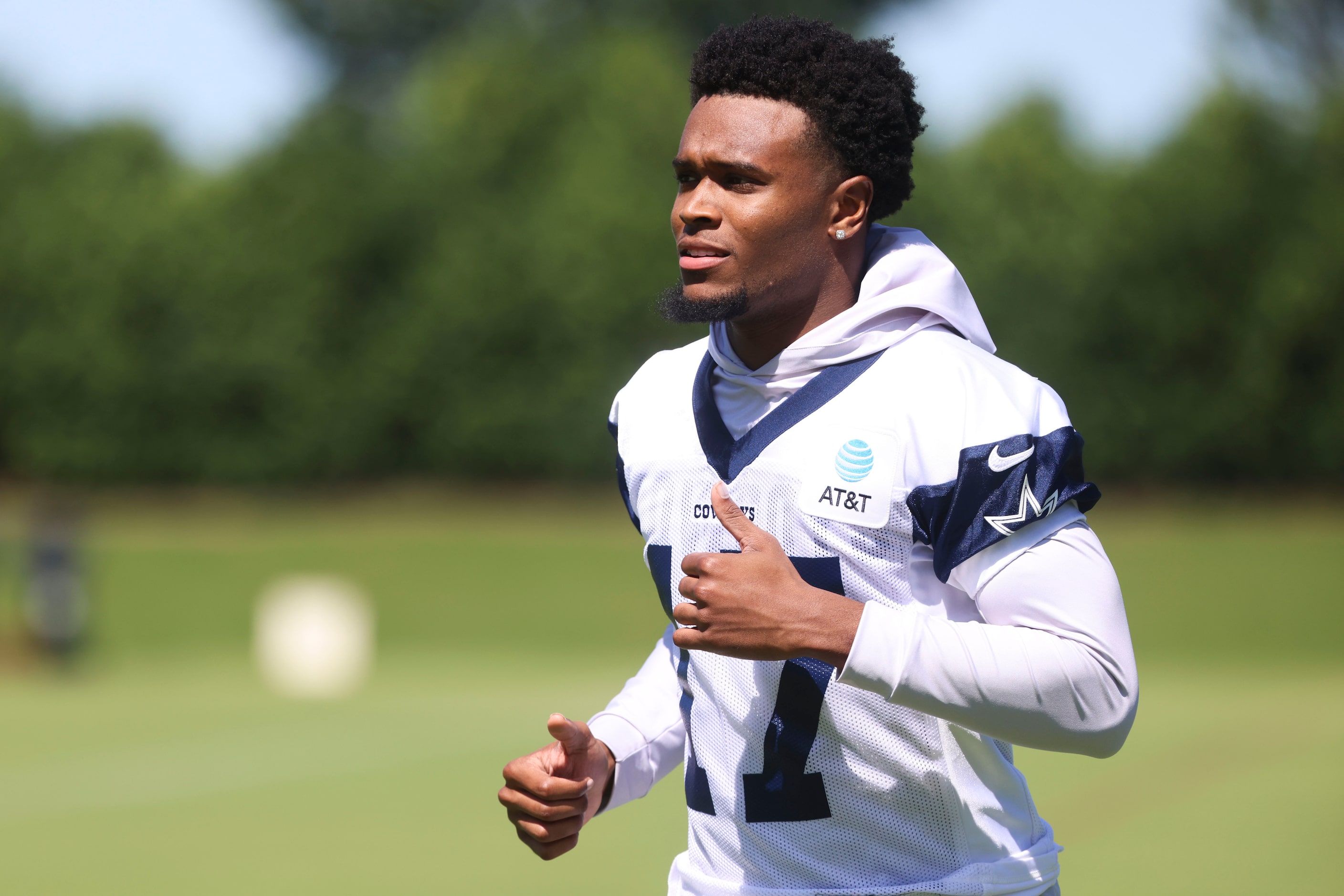 Dallas Cowboys wide receiver Corey Crooms exits the field following a rookie minicamp, on...