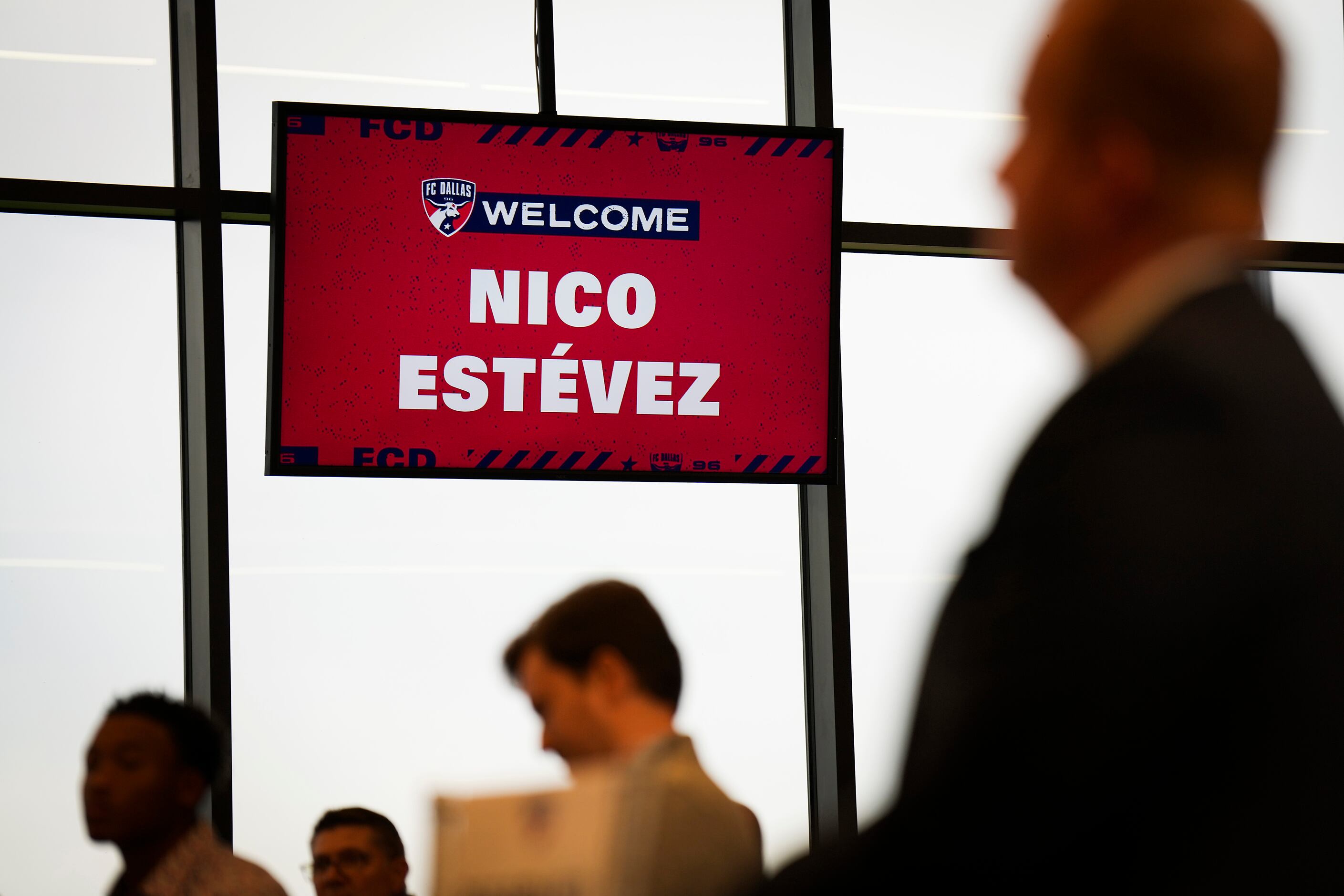 Frisco mayor Jeff Cheney (right) listens as new FC Dallas head coach Nico Estévez addresses...