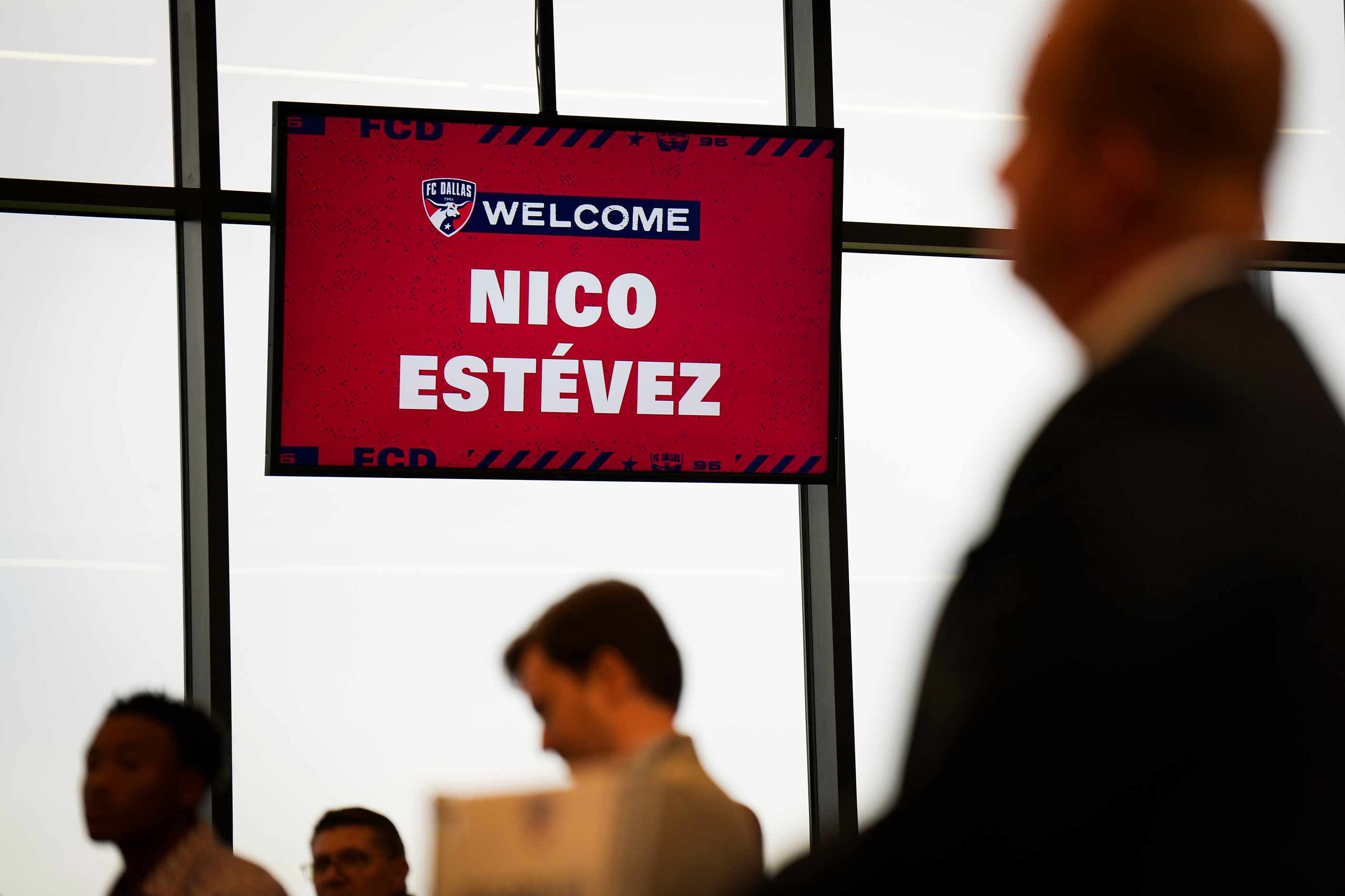 Frisco mayor Jeff Cheney (right) listens as new FC Dallas head coach Nico Estévez addresses...