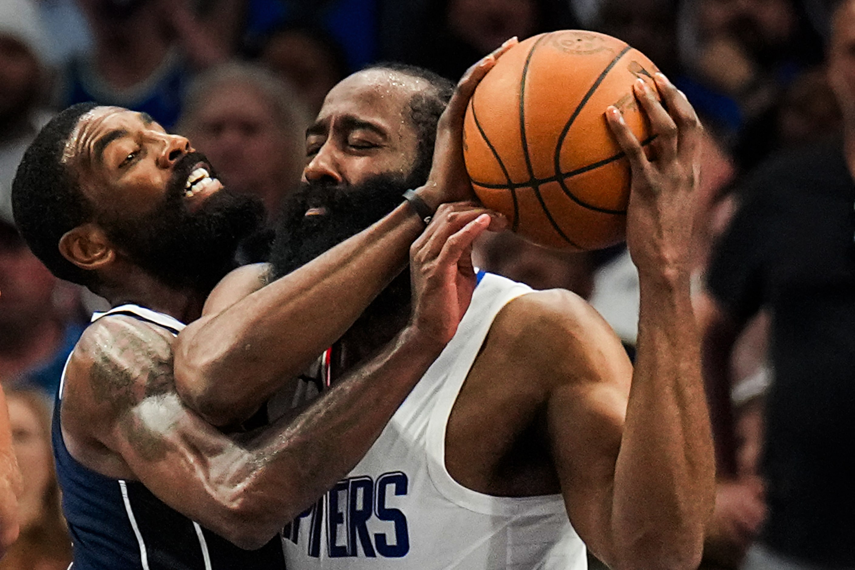 LA Clippers guard James Harden (1) is fouled by Dallas Mavericks guard Kyrie Irving (11)...