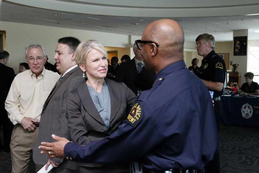 District Attorney Susan Hawk greeted Dallas Police Chief David Brown while attending a...