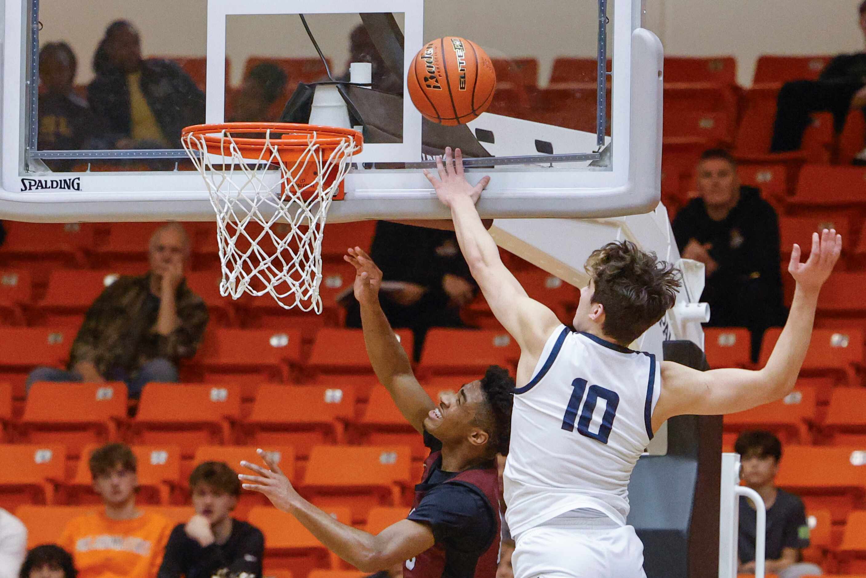 Keller high’s Steven Ramirez (right) reaches to block as Lewisville High’s Princeton Green...