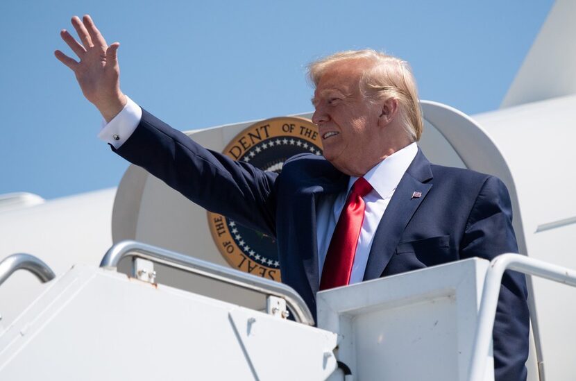 US President Donald Trump disembarks from Air Force One upon arrival at Francis S. Gabreski...