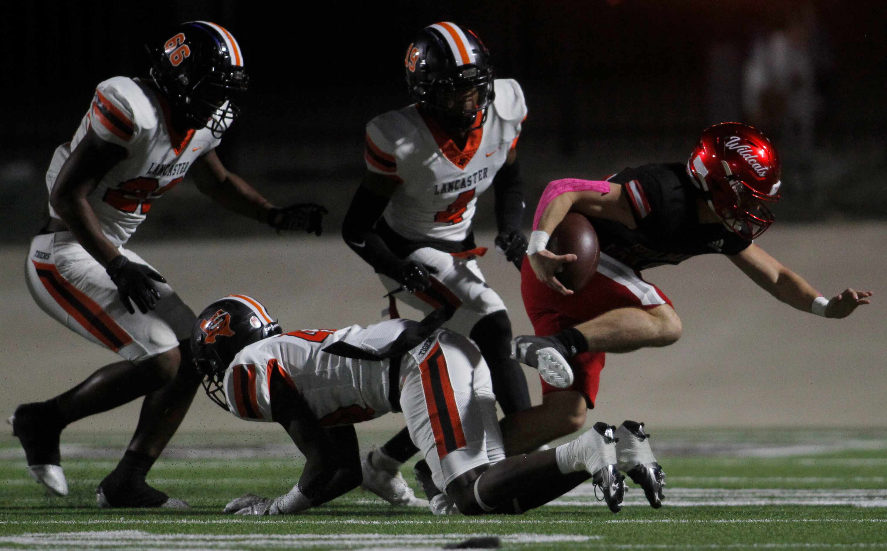 Dallas Woodrow Wilson running back Nathan Barrilleaux (22) attempts to spin out of traffic...