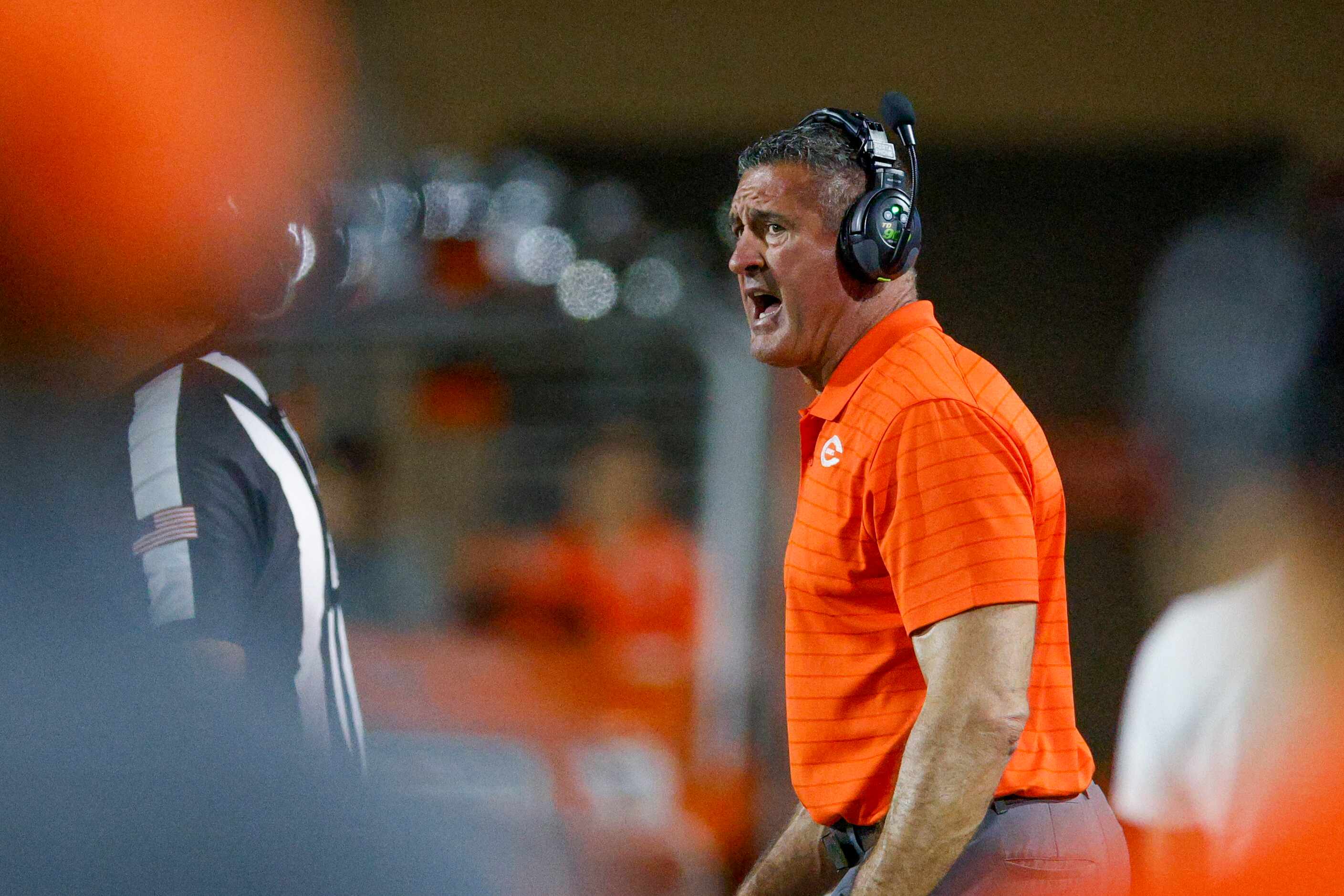 Celina head coach Bill Elliott coaches from the sideline during the second half of their...