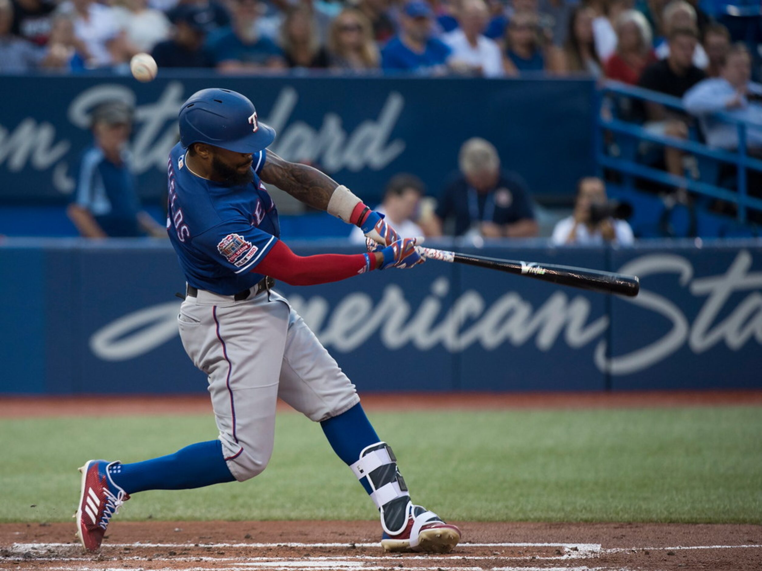 Texas Rangers center fielder Delino DeShields (3) hits a foul ball against the Toronto Blue...