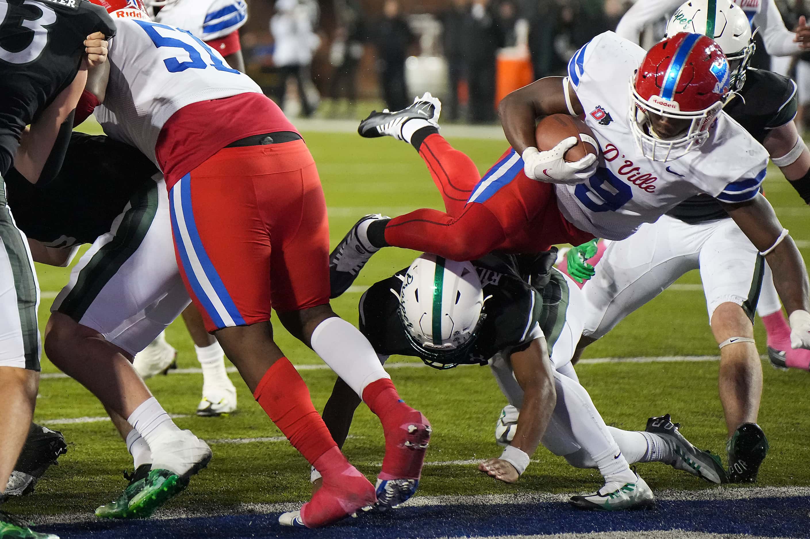 Duncanville running back Kaleb Kenney (9) dives into the end zone to score on a one-yard run...