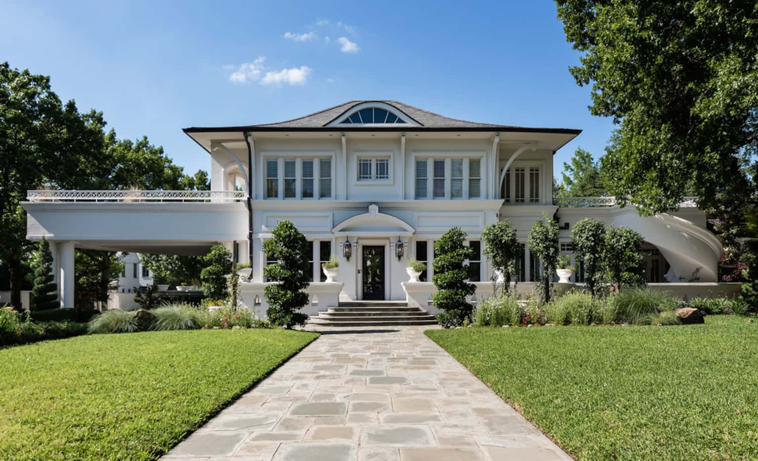 A $12.5 million Highland Park estate owned by a tax attorney recently visted by the feds is...