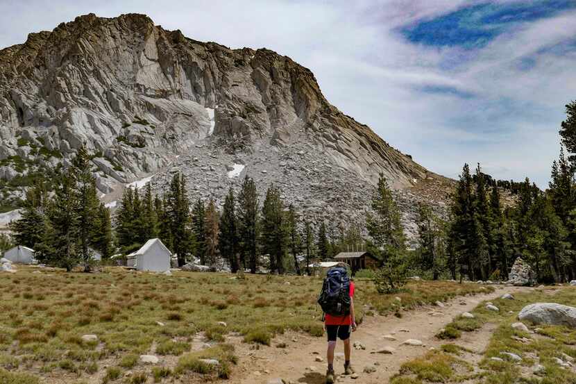 Andy Irwin, 13, approaches the Vogelsang High Sierra Camp at the base of Fletcher Peak in...
