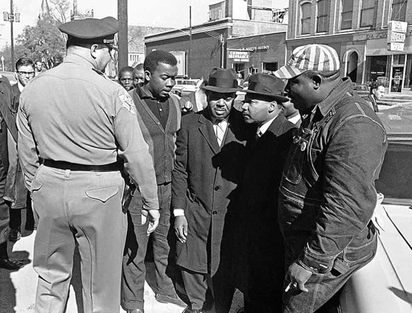  Dr. Martin Luther King Jr., right, and Dallas County Sheriff Jim Clark glare at each other...