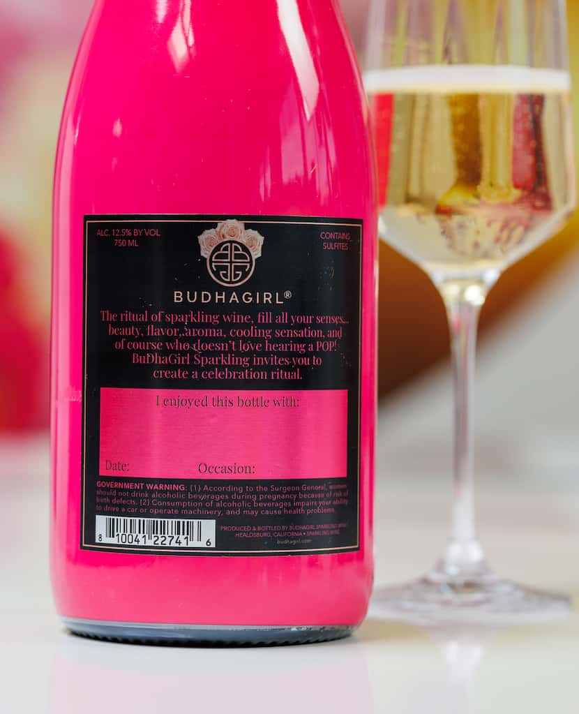 The back label on a BuDhaGirl sparkling wine bottle has spaces to fill in and personalize...